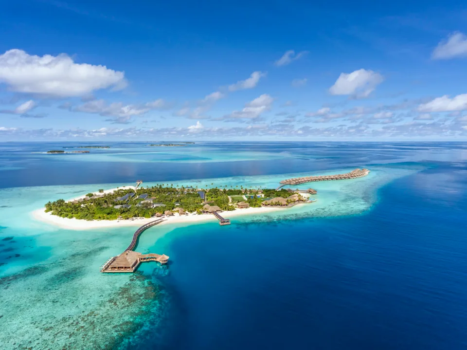 Aerial view of Hurawalhi island and overwater villas, Maldives