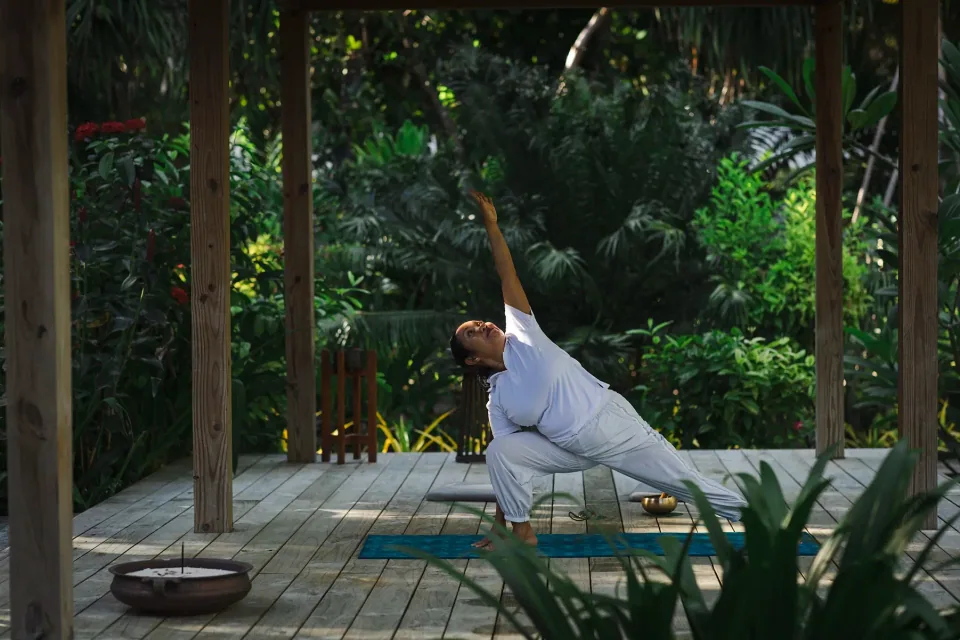 Yoga on a shaded outdoor deck at Niva Labriz