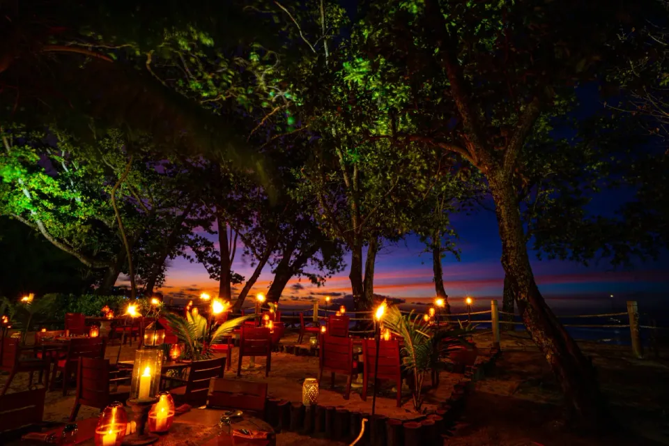 Lantern-lit outdoor tables at Eden, STORY Seychelles