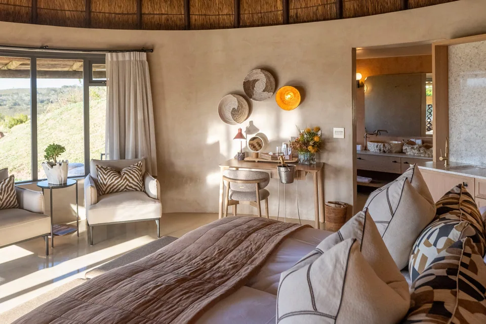 Kwena Lodge bedroom beneath a domed thatch roof