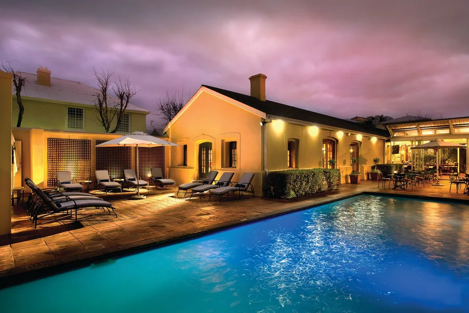 The Portswood Hotel pool courtyard at dusk, Cape Town.