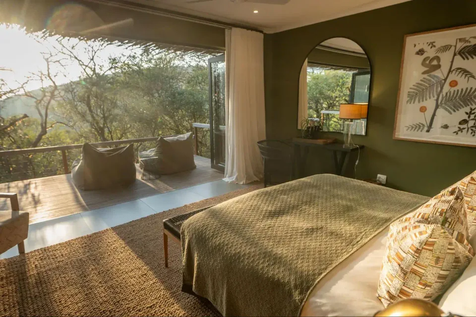Sungulwane bedroom opening onto a private bush-view deck